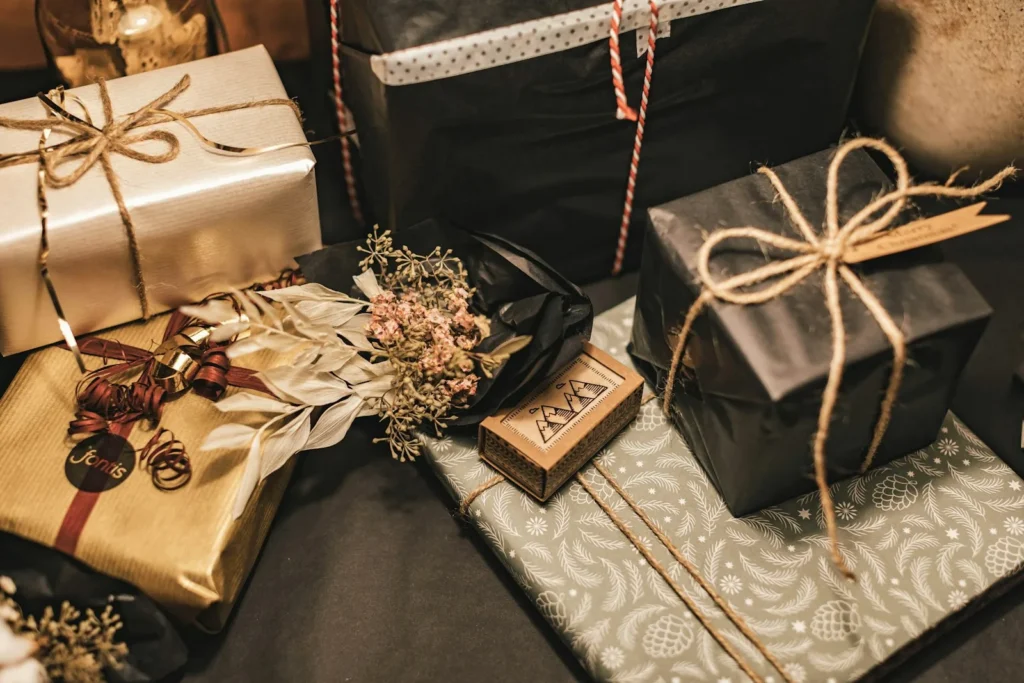 Styled celebration tablescape with a gift being placed